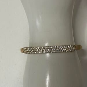 gold tone bangle bracelet hinged with rhinestone detail costume signed jewelry